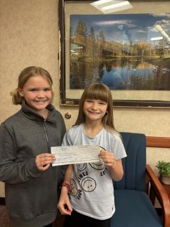 Brylee and Avery Westring give Foothills $500 check