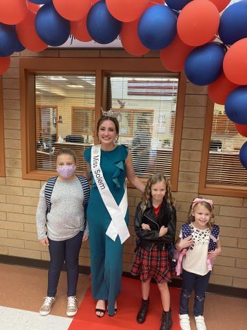 Miss Salem welcomes students to school.