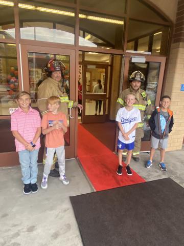 Salem Firefighters help welcome back students.