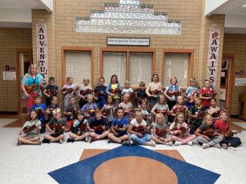 3rd Grade Students with Violins