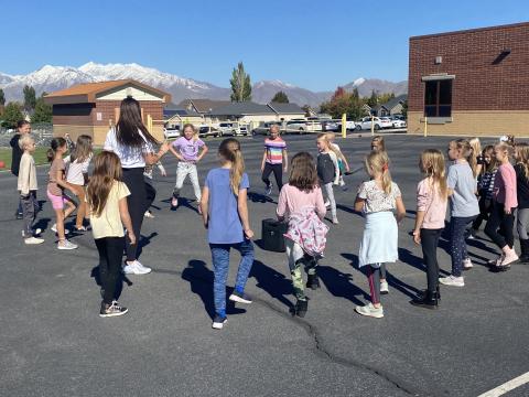 Students dancing outside