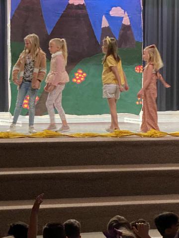 Students participate in play