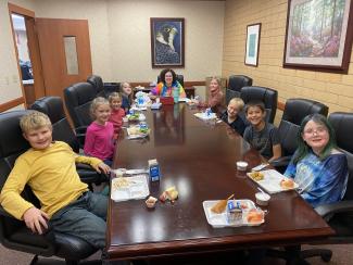Students eating lunch with Mrs. Stoddard